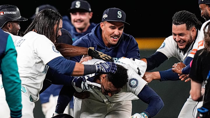 Seattle Mariners players celebrate 3-2 win over Detroit Tigers in 15 innings during Game 5 of the ALDS at T-Mobile Park in Seattle on Friday.