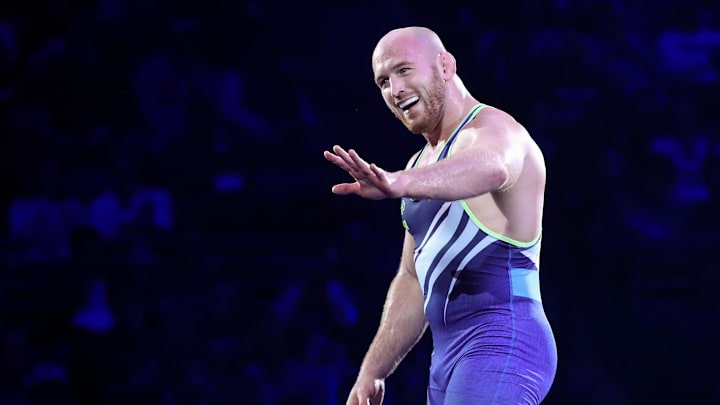 Apr 20, 2024; State College, Pennsylvania, USA; Kyle Snyder waves to his family after defeating Isaac Trumble (not pictured) 4-0 by decision in the 97 kilograms freestyle Championship Final during day two of the U.S. Olympic Wrestling Team Trials at Bryce Jordan Center at Penn State. Mandatory Credit: Matthew O'Haren-Imagn Images