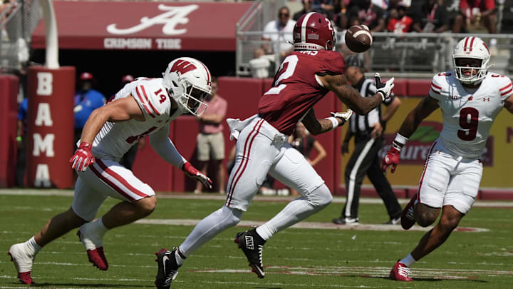 Sep 13, 2025; Tuscaloosa, Alabama, USA;  Alabama wide receiver Ryan Williams (2) makes a catch between Wisconsin defensive back Preston Zachman (14) and Wisconsin defensive back Austin Brown (9) at Saban Field at Bryant-Denny Stadium. Mandatory Credit: Gary Cosby-USA TODAY Network via Imagn Images