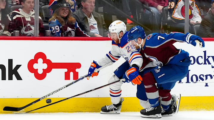 Edmonton Oilers right wing Connor Brown (28) and Colorado Avalanche defenseman Devon Toews (7)