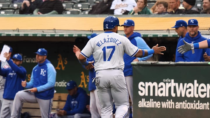 Jun 19, 2024; Oakland, California, USA; Kansas City Royals designated hitter Nelson Velazquez (17) high fives teammates after scoring a run against the Oakland Athletics during the fifth inning at Oakland-Alameda County Coliseum. Mandatory Credit: Kelley L Cox-Imagn Images