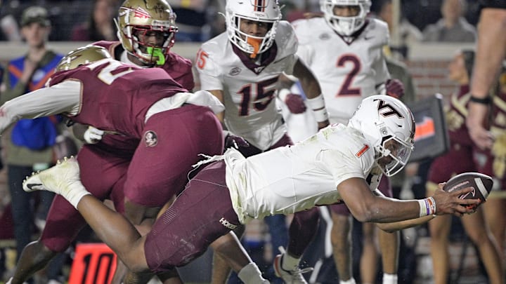Nov 15, 2025; Tallahassee, Florida, USA; Virginia Tech Hokies quarterback Kyron Drones (1) dives for a touchdown during the first half against the Florida State Seminoles at Doak S. Campbell Stadium. Mandatory Credit: Melina Myers-Imagn Images Nov 15, 2025; Tallahassee, Florida, USA; Virginia Tech Hokies quarterback Kyron Drones (1) dives for a touchdown during the first half against the Florida State Seminoles at Doak S. Campbell Stadium. Mandatory Credit: Melina Myers-Imagn Images