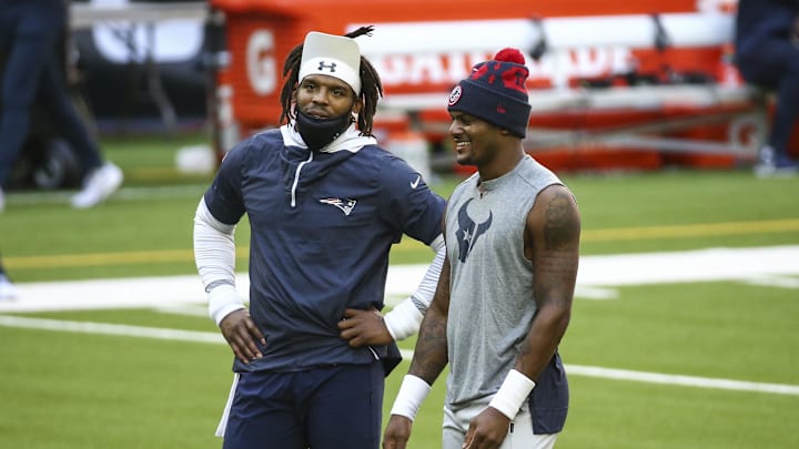 Nov 22, 2020; Houston, Texas, USA; New England Patriots quarterback Cam Newton (left) and Houston Texans quarterback Deshaun Watson (right) talk on the field before the game at NRG Stadium. Mandatory Credit: Troy Taormina-Imagn Images