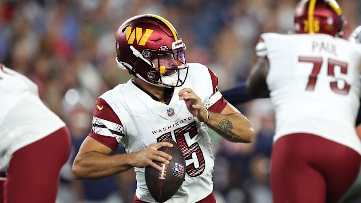 Aug 8, 2025; Foxborough, Massachusetts, USA; Washington Commanders quarterback Sam Hartman (15) drops back to pass during the first half against the New England Patriots at Gillette Stadium. Mandatory Credit: Paul Rutherford-Imagn Images