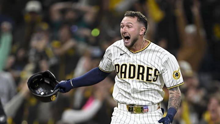 Apr 15, 2026; San Diego, California, USA; San Diego Padres center fielder Jackson Merrill celebrates after hitting a walk-off double during the ninth inning against the Seattle Mariners at Petco Park. All MLB players are wearing number 42 today to honor Jackie Robinson. Mandatory Credit: Denis Poroy-Imagn Images