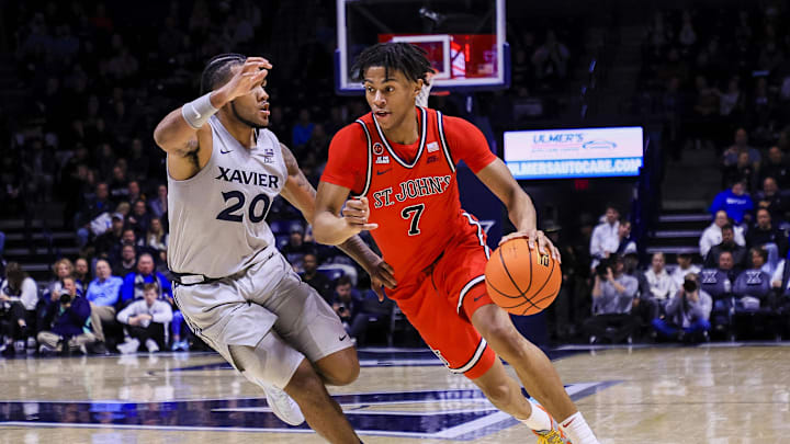 Jan 7, 2025; Cincinnati, Ohio, USA; St. John's basketball guard Simeon Wilcher (7) dribbles against Xavier Musketeers guard Dayvion McKnight (20) in the second half at Cintas Center.