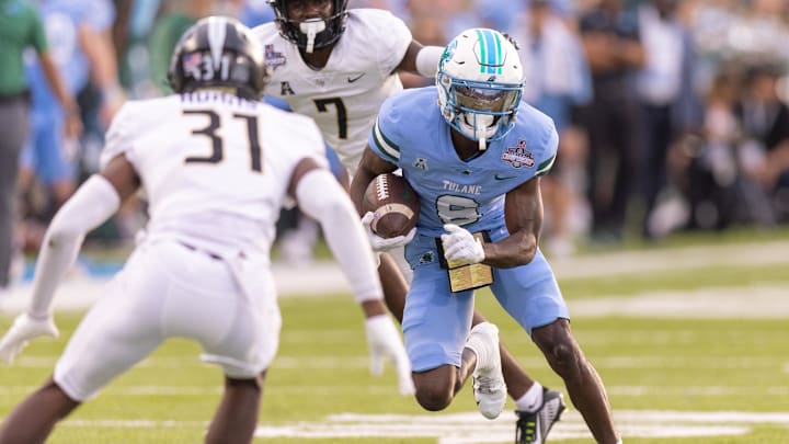 Dec 3, 2022; New Orleans, Louisiana, USA; Tulane Green Wave wide receiver Lawrence Keys III (6) rushes against UCF Knights cornerback Brandon Adams (31) during the first half at Yulman Stadium. Dec 3, 2022; New Orleans, Louisiana, USA; Tulane Green Wave wide receiver Lawrence Keys III (6) rushes against UCF Knights cornerback Brandon Adams (31) during the first half at Yulman Stadium.