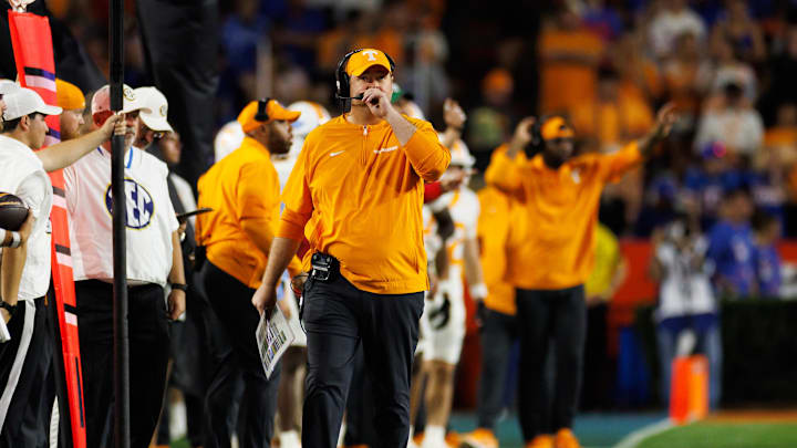 Nov 22, 2025; Gainesville, Florida, USA; Tennessee Volunteers head coach Josh Heupel walks the sideline against the Florida Gators during the first half at Ben Hill Griffin Stadium. Mandatory Credit: Matt Pendleton-Imagn Images