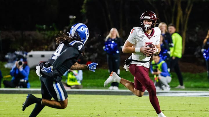 Nov 23, 2024; Durham, North Carolina, USA; Virginia Tech Hokies quarterback Collin Schlee (3) runs with the football chased by Duke Blue Devils linebacker Cameron Bergeron (4) during the second half of the game against Duke Blue Devils at Wallace Wade Stadium. Mandatory Credit: Jaylynn Nash-Imagn Images