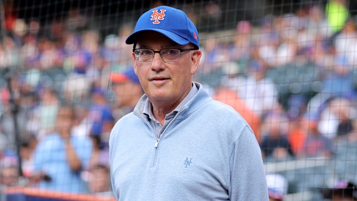 Aug 14, 2025; New York City, New York, USA; New York Mets owner Steve Cohen stands on the field before a ceremony to honor first baseman Pete Alonso (not pictured) for breaking the Mets all time home run record before a game against the Atlanta Braves at Citi Field. Mandatory Credit: Brad Penner-Imagn Images
