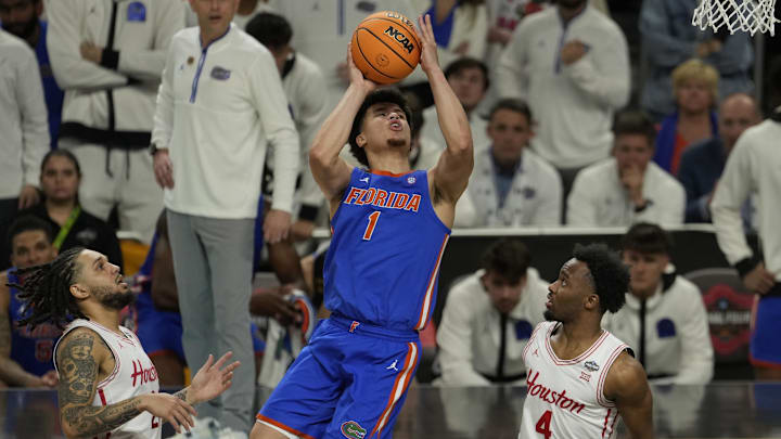 Apr 7, 2025; San Antonio, TX, USA; Florida Gators guard Walter Clayton Jr. (1) shoots the ball against Houston Cougars guard L.J. Cryer (4) during the second half in the national championship game of the Final Four of the 2025 NCAA Tournament at the Alamodome. Apr 7, 2025; San Antonio, TX, USA; Florida Gators guard Walter Clayton Jr. (1) shoots the ball against Houston Cougars guard L.J. Cryer (4) during the second half in the national championship game of the Final Four of the 2025 NCAA Tournament at the Alamodome.
