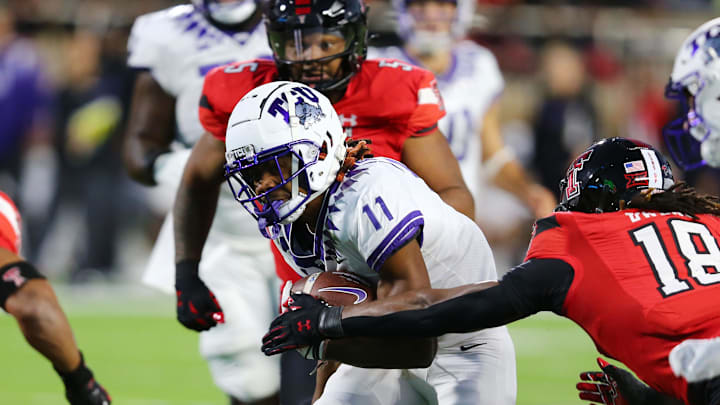 Former Texas Christian Horned Frogs wide receiver JoJo Earl (11) rushes against Texas Tech Red Raiders defensive safety Tyler Owens (18) in the first half at Jones AT&T Stadium and Cody Campbell Field. 