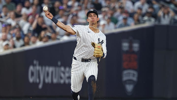 May 2, 2025; Bronx, New York, USA; New York Yankees third baseman Oswaldo Cabrera (95) throws the ball to first base for an out during the fourth inning against the Tampa Bay Rays at Yankee Stadium. Mandatory Credit: Vincent Carchietta-Imagn Images
