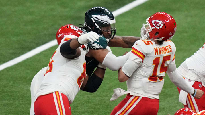 Feb 9, 2025; New Orleans, LA, USA; Kansas City Chiefs quarterback Patrick Mahomes (15) is sacked by Philadelphia Eagles defensive tackle Jalen Carter (98) and defensive tackle Milton Williams (93) during the fourth quarter in Super Bowl LIX at Caesars Superdome. Mandatory Credit: Kirby Lee-Imagn Images