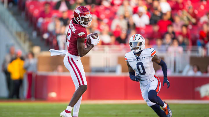 Nov 11, 2023; Fayetteville, Arkansas, USA;  Arkansas Razorbacks wide receiver Andrew Armstrong (2) makes a catch as Auburn Tigers cornerback Keionte Scott (0) defends during the second quarter at Donald W. Reynolds Razorback Stadium. Mandatory Credit: Brett Rojo-Imagn Images