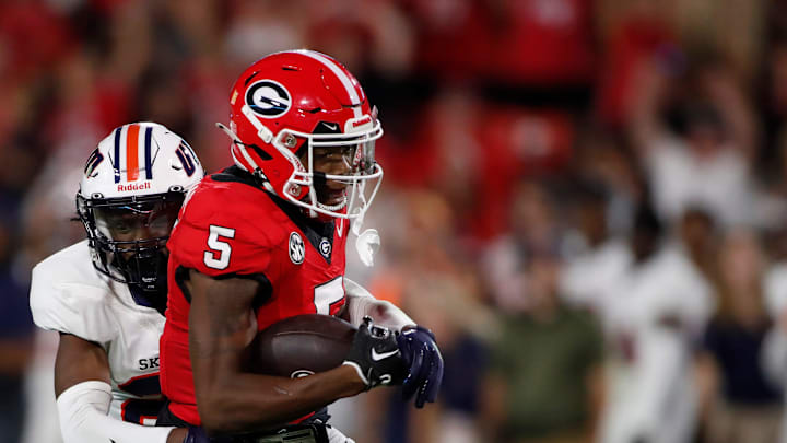 Georgia wide receiver Rara Thomas (5) tries to fight off a tackle from Tennessee Martin safety Antonio Jackson (23) after making a big catch during the second half of a NCAA college football game against Tennessee Martin in Athens, Ga., on Saturday, Sept. 2, 2023. Georgia won 48-7. Georgia wide receiver Rara Thomas (5) tries to fight off a tackle from Tennessee Martin safety Antonio Jackson (23) after making a big catch during the second half of a NCAA college football game against Tennessee Martin in Athens, Ga., on Saturday, Sept. 2, 2023. Georgia won 48-7.