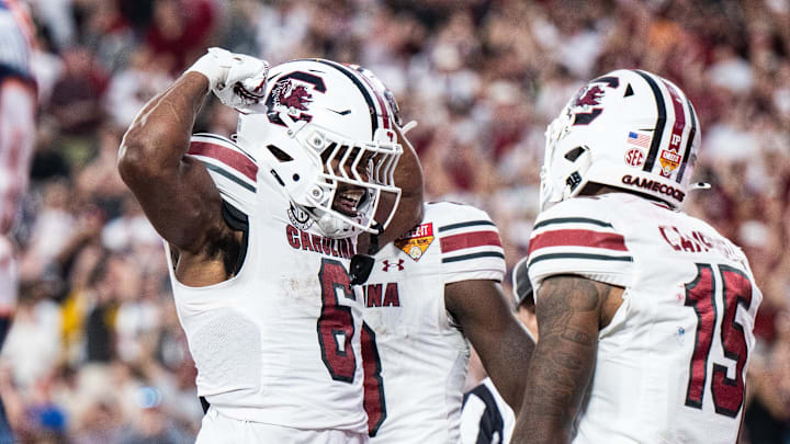 Dec 31, 2024; Orlando, FL, USA; South Carolina Gamecocks running back Dylan Stewart (6) celebrates his touchdown against the Illinois Fighting Illini in the fourth quarter at Camping World Stadium. Mandatory Credit: Jeremy Reper-Imagn Images