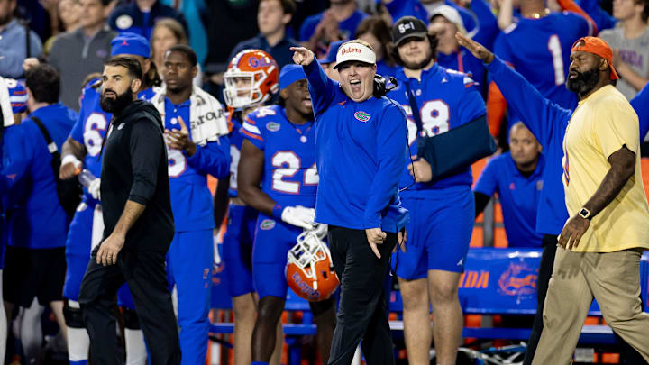 Florida Gators defensive coordinator Austin Armstrong smiles and gestures after a defensive stop during the second half against the Florida State Seminoles at Steve Spurrier Field at Ben Hill Griffin Stadium in Gainesville, FL on Saturday, November 25, 2023. [Matt Pendleton/Gainesville Sun]