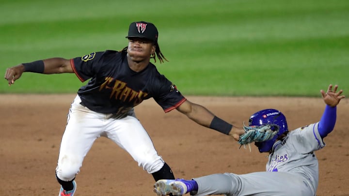Wisconsin Timber Rattlers' Jesus Made (12) tags out Quad Cities River Bandits' Eridk Torres (4) at second base during their baseball game Wednesday, August 27, 2025, at Neuroscience Group Field at Fox Cities Stadium in Grand Chute, Wisconsin. Quad City won 9-5.