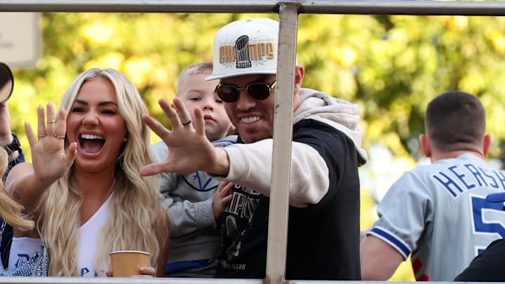  Los Angeles Dodgers first base Freddie Freeman (right) celebrates with his wife Chelsea Freeman during the 2024 World Series Championship parade in downtown Los Angeles. 