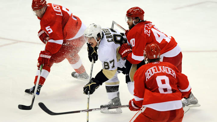 May 30, 2009; Detroit, MI, USA; Pittsburgh Penguins center Sidney Crosby (87) is shoved from behind by Detroit Red Wings center Henrik Zetterberg (40) in the third period of game one of the 2009 Stanley Cup finals at Joe Louis Arena.  The Red Wings won 3-1. Mandatory Credit: Leon Halip-Imagn Images