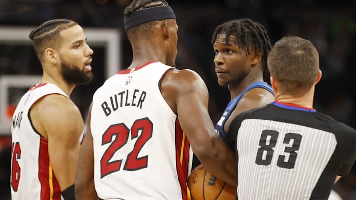 Nov 24, 2021; Minneapolis, Minnesota, USA; Miami Heat forward Jimmy Butler (22) and Minnesota Timberwolves forward Anthony Edwards (1) exchange some actions before each receiving a technical foul in the third quarter as referee Andy Nagy (83) and forward Caleb Martin (16) step in at Target Center. Mandatory Credit: Bruce Kluckhohn-Imagn Images Nov 24, 2021; Minneapolis, Minnesota, USA; Miami Heat forward Jimmy Butler (22) and Minnesota Timberwolves forward Anthony Edwards (1) exchange some actions before each receiving a technical foul in the third quarter as referee Andy Nagy (83) and forward Caleb Martin (16) step in at Target Center. Mandatory Credit: Bruce Kluckhohn-Imagn Images