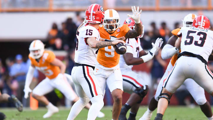 Tennessee defensive lineman Tyler Baron (9) defends Georgia quarterback Carson Beck (15) during a football game between Tennessee and Georgia at Neyland Stadium in Knoxville, Tenn., on Saturday, Nov. 18, 2023.