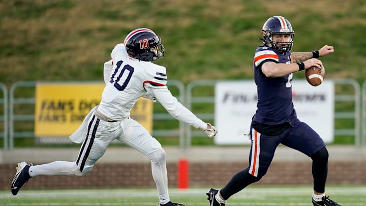 Nashville Christian's Jared Curtis (2) evades Columbia Academy's Jake Ballard (10) during the third quarter of the Division II-A championship game at Finley Stadium in Chattanooga, Tenn., Thursday, Dec. 5, 2024.