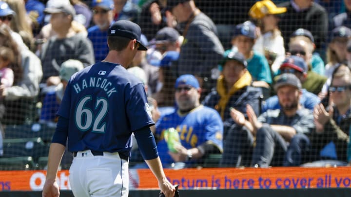 Seattle Mariners starting pitcher Emerson Hancock (62) walks to the dugout after being relieved for against the Atlanta Braves during the fourth inning at T-Mobile Park in May 2024.