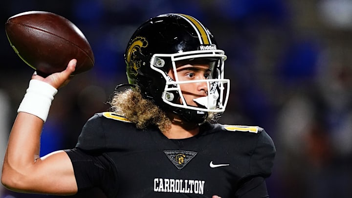 Oct 20, 2023; Carrollton, GA, USA; Carrollton Trojans quarterback Julian Lewis (10) drops back to