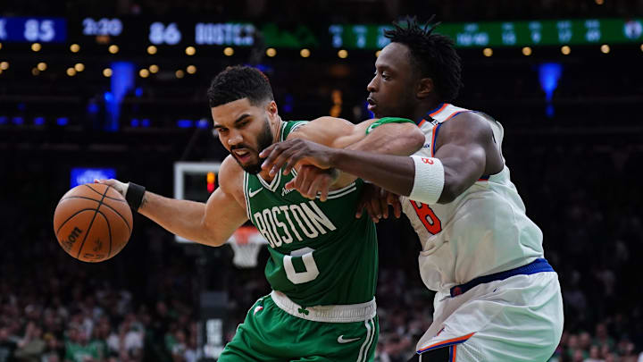 May 7, 2025; Boston, Massachusetts, USA; New York Knicks forward OG Anunoby (8) defends against Boston Celtics forward Jayson Tatum (0) in the fourth quarter during game two of the second round for the 2025 NBA Playoffs at TD Garden. Mandatory Credit: David Butler II-Imagn Images