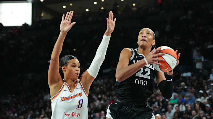 Oct 3, 2025; Las Vegas, Nevada, USA; Las Vegas Aces center A'ja Wilson (22) looks to shoot against Phoenix Mercury forward Satou Sabally (0) during the fourth quarter of game one of the 2025 WNBA Finals at Michelob Ultra Arena. Mandatory Credit: Stephen R. Sylvanie-Imagn Images