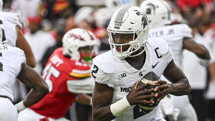 Sep 7, 2024; College Park, Maryland, USA;  Michigan State Spartans quarterback Aidan Chiles (2) rolls pit top pass during the first half against the Maryland Terrapins at SECU Stadium. Mandatory Credit: Tommy Gilligan-Imagn Images