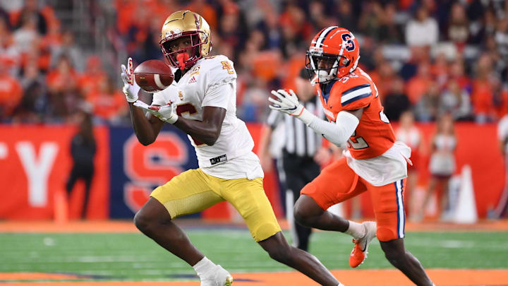 Nov 3, 2023; Syracuse, New York, USA; Boston College Eagles wide receiver Jaden Skeete (6) catches the ball as Syracuse Orange defensive back Gregory Elaine (32) defends during the second half at the JMA Wireless Dome. Mandatory Credit: Rich Barnes-Imagn Images