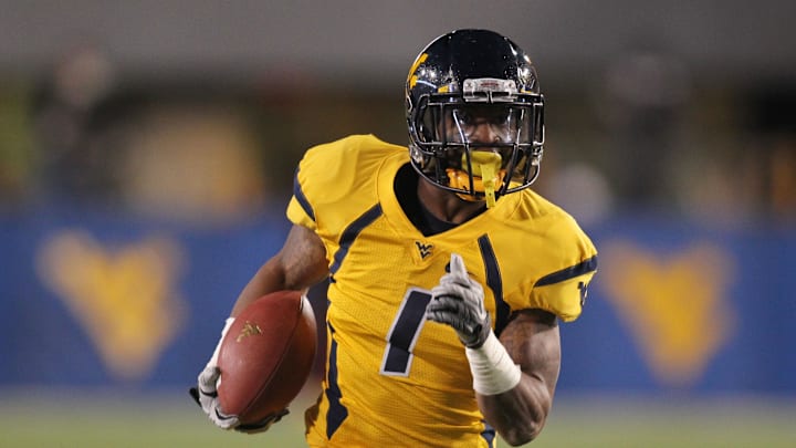 November 17, 2012; Morgantown, WV, USA; West Virginia Mountaineers wide receiver Tavon Austin (1) carries the ball on a 31 yard gain against the Oklahoma Sooners during the first quarter at Milan Puskar Stadium. The Oklahoma Sooners won 50-49. Mandatory Credit: Charles LeClaire-Imagn Images