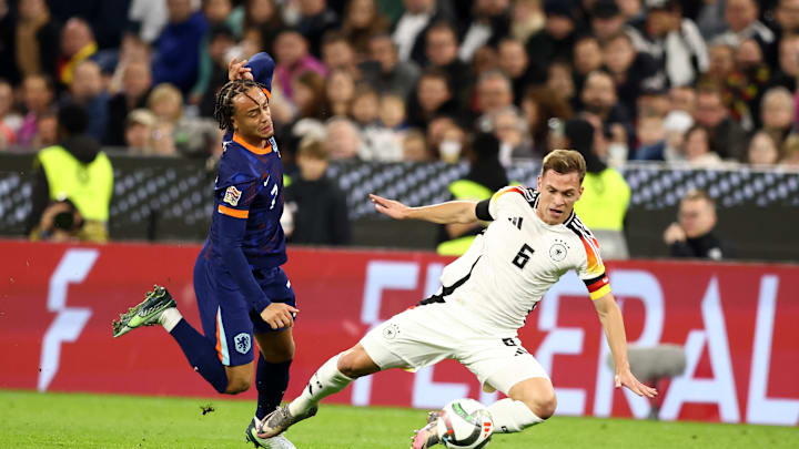Joshua Kimmich wins the ball off of Xavi Simons