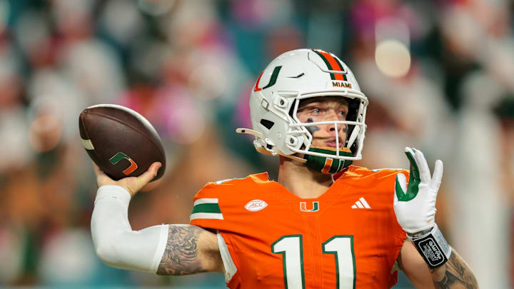 Oct 17, 2025; Miami Gardens, Florida, USA; Miami Hurricanes quarterback Carson Beck (11) throws the football against the Louisville Cardinals during the second quarter at Hard Rock Stadium. Mandatory Credit: Sam Navarro-Imagn Images