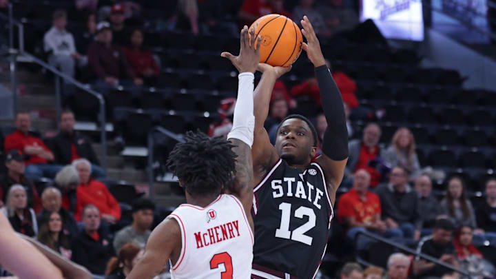 Mississippi State Bulldogs guard Josh Hubbard (12) prepares to shoot over Utah Utes guard Don McHenry (3) during the first half at Delta Center. 