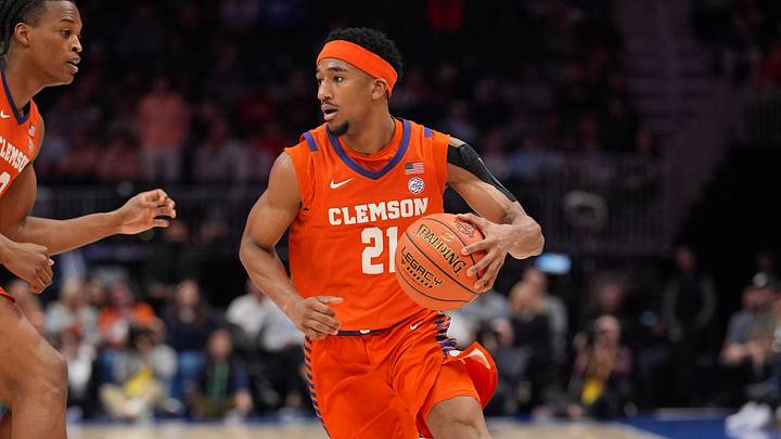 Mar 12, 2026; Charlotte, NC, USA; Clemson Tigers guard Ace Buckner (21) dribbles the ball during the second half against the North Carolina Tar Heels at Spectrum Center. Mandatory Credit: Jim Dedmon-Imagn Images