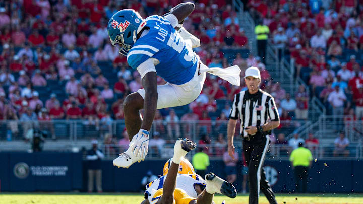 Ole Miss running back Kewan Lacy (5) jumps over a defender during a college football game between Ole Miss and LSU at Vaught-Hemingway Stadium in Oxford, Miss., on Saturday, Sept. 27, 2025. Ole Miss defeated LSU 24-19.