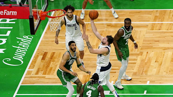Jun 17, 2024; Boston, Massachusetts, USA; Dallas Mavericks guard Luka Doncic (77) shoots the ball against Boston Celtics forward Jayson Tatum (0) in game five of the 2024 NBA Finals at TD Garden. Mandatory Credit: Peter Casey-Imagn Images Jun 17, 2024; Boston, Massachusetts, USA; Dallas Mavericks guard Luka Doncic (77) shoots the ball against Boston Celtics forward Jayson Tatum (0) in game five of the 2024 NBA Finals at TD Garden. Mandatory Credit: Peter Casey-Imagn Images