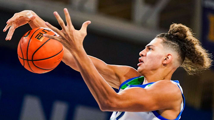 Florida Gulf Coast Eagles forward Isaiah Malone (32) tries to get possession of a ball during the second half of a GEICO Coconut Hoops Tournament Tarpon Bay division game against the Oral Roberts Golden Eagles at Alico Arena on Fort Myers, Fla., on Monday, Nov. 24, 2025.