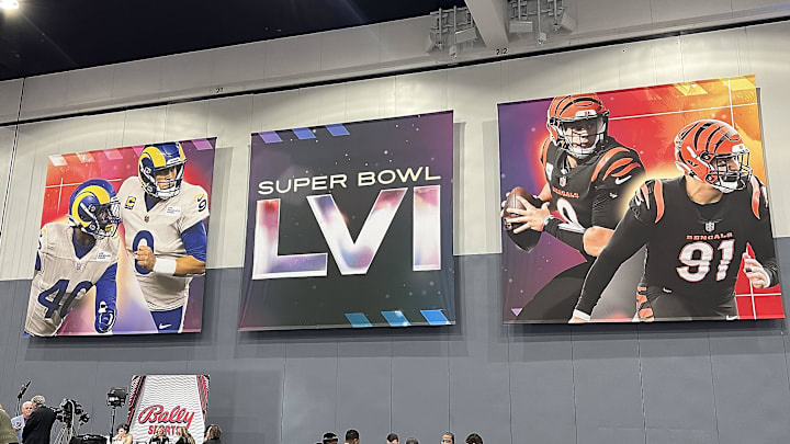 Feb 7, 2022; Los Angeles, CA, USA; Signage with the likeness of Los Angeles Rams players Matthew Stafford and Von Miller with Cincinnatti Bengals players Joe Burrow and Trey Hendrickson displayed at the Super Bowl LVI media center at Los Angeles Convention Center. Mandatory Credit: Gary A. Vasquez-Imagn Images