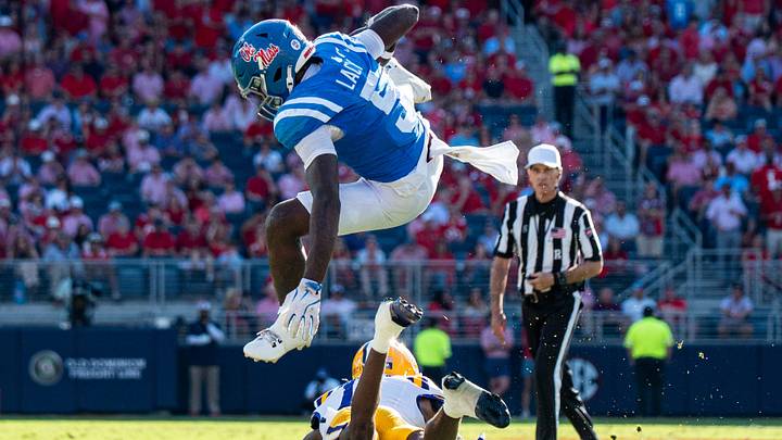 Ole Miss running back Kewan Lacy (5) jumps over a defender during a college football game between Ole Miss and LSU at Vaught-Hemingway Stadium in Oxford, Miss., on Saturday, Sept. 27, 2025. Ole Miss defeated LSU 24-19.