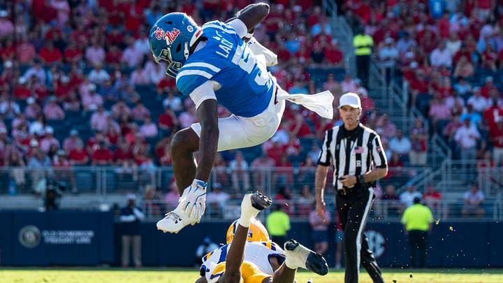 Ole Miss running back Kewan Lacy (5) jumps over a defender during a college football game between Ole Miss and LSU at Vaught-Hemingway Stadium in Oxford, Miss., on Saturday, Sept. 27, 2025. Ole Miss defeated LSU 24-19. Ole Miss running back Kewan Lacy (5) jumps over a defender during a college football game between Ole Miss and LSU at Vaught-Hemingway Stadium in Oxford, Miss., on Saturday, Sept. 27, 2025. Ole Miss defeated LSU 24-19.