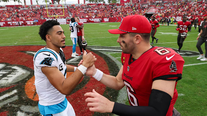 Dec 29, 2024; Tampa, Florida, USA; Tampa Bay Buccaneers quarterback Baker Mayfield (6) great Carolina Panthers quarterback Bryce Young (9) after a game at Raymond James Stadium. Mandatory Credit: Nathan Ray Seebeck-Imagn Images