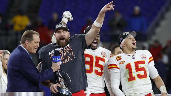 Jan 28, 2024; Baltimore, Maryland, USA; Kansas City Chiefs tight end Travis Kelce (M) celebrates with the Lamar Hunt trophy next to Chiefs defensive tackle Chris Jones (95) and Chiefs quarterback Patrick Mahomes (15) while speaking with CBS broadcaster Jim Nantz (L) after the Chiefs' game against the Baltimore Ravens in the AFC Championship football game at M&T Bank Stadium. Mandatory Credit: Geoff Burke-Imagn Images Jan 28, 2024; Baltimore, Maryland, USA; Kansas City Chiefs tight end Travis Kelce (M) celebrates with the Lamar Hunt trophy next to Chiefs defensive tackle Chris Jones (95) and Chiefs quarterback Patrick Mahomes (15) while speaking with CBS broadcaster Jim Nantz (L) after the Chiefs' game against the Baltimore Ravens in the AFC Championship football game at M&T Bank Stadium. Mandatory Credit: Geoff Burke-Imagn Images