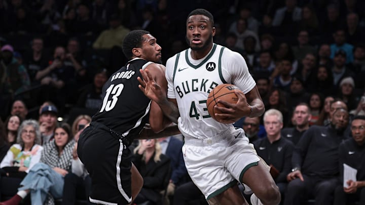 Dec 27, 2023; Brooklyn, New York, USA; Milwaukee Bucks forward Thanasis Antetokounmpo (43) drives to the basket against Brooklyn Nets guard Armoni Brooks (13) during the second half at Barclays Center. Mandatory Credit: Vincent Carchietta-Imagn Images
