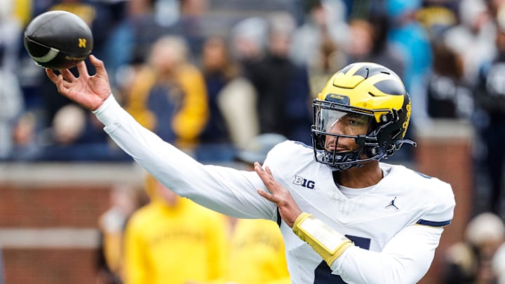 Maize Team quarterback Jayden Denegal (4) warms up during the spring game at Michigan Stadium in Ann Arbor on Saturday, April 20, 2024.