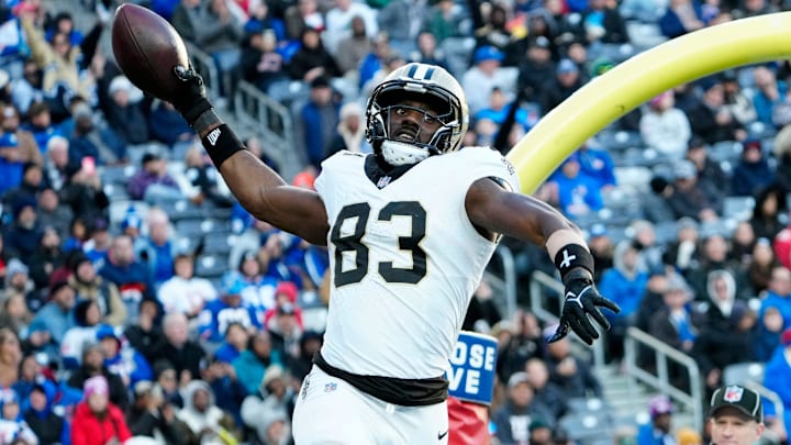New Orleans Saints tight end Juwan Johnson (83) gets ready to spike the ball after scoring a touchdown, Sunday, December 8, 2024, in East Rutherford.